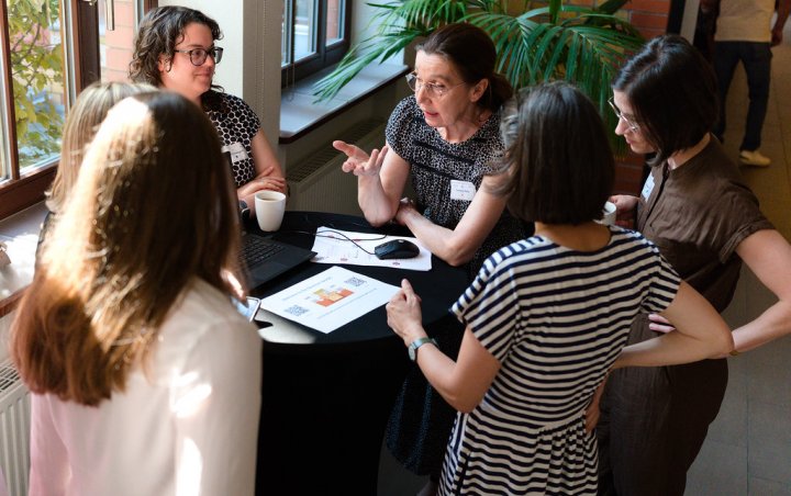 Team members engaged in a lively discussion about ongoing projects.