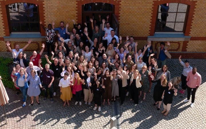 Eurice and RISE teams gather together, waving at the camera.