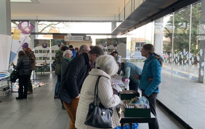 Visitors browsing the stalls at the seed exchange Visitors browsing the stalls at the seed exchange